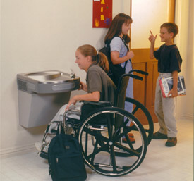 Woman in wheelchair drinking from an Elkay EZS8 Water Cooler